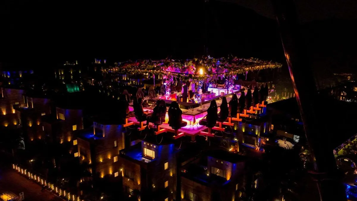 Della Sky Garden, a dining platform 150 feet in the air, at night